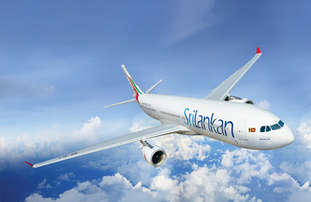 A SriLankan Airlines plane in flight among the clouds
